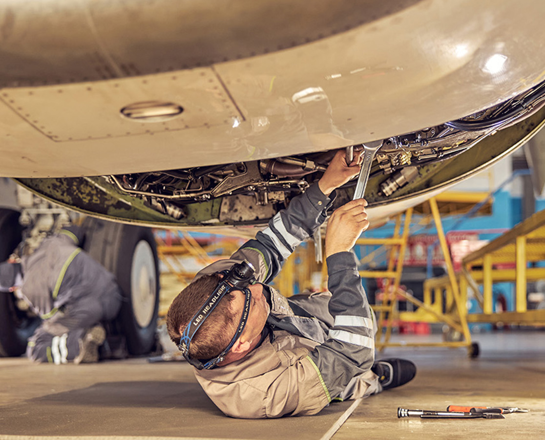 aircraft technician working on a private jet