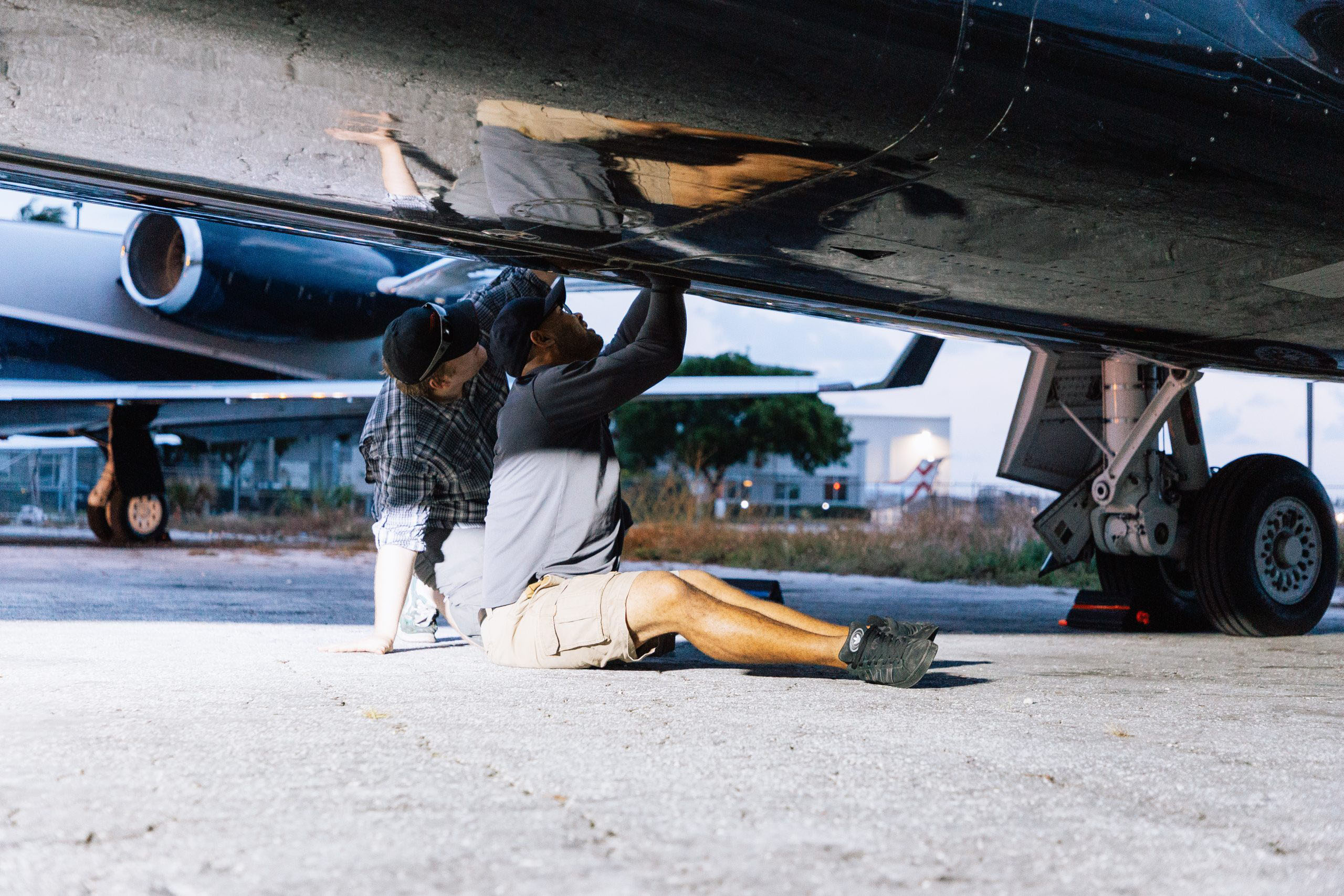 alerion airplane mechanics working on a private jet